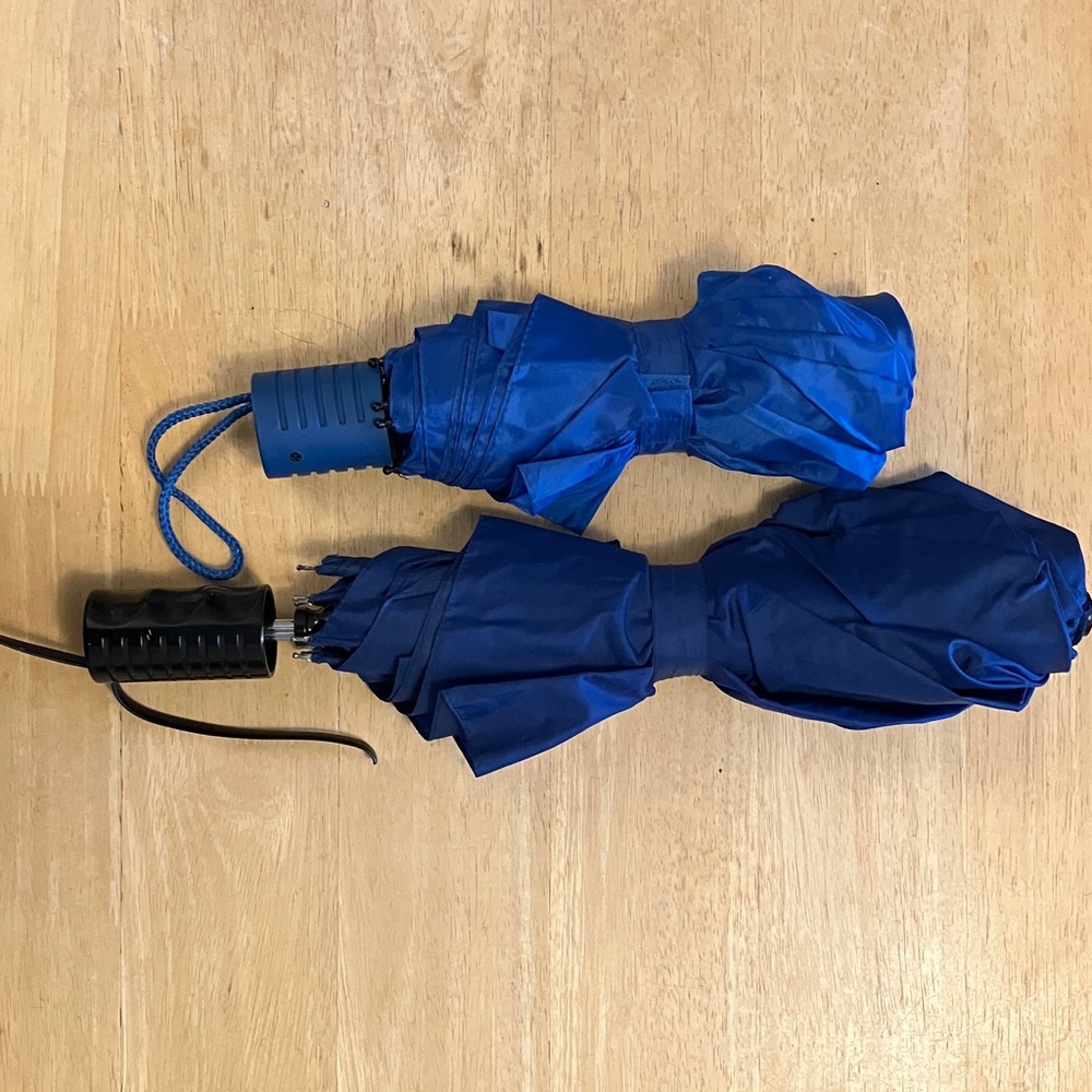 Two blue travel umbrellas